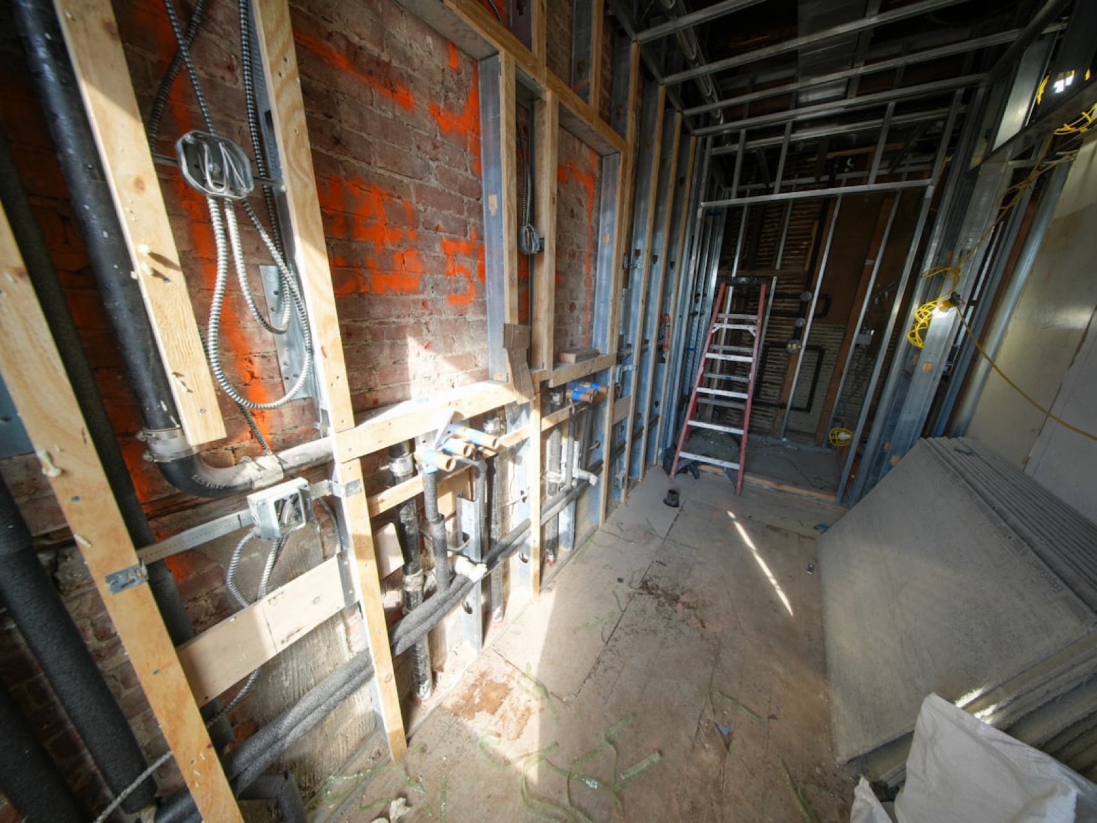 Hoffmeyer plumber and HVAC technician at work on residential pipes and equipment in Huron County