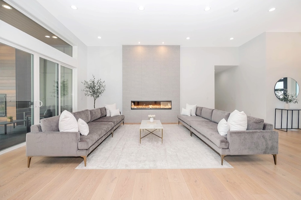 Modern gas fireplace with a lit flame in a Huron County living room
