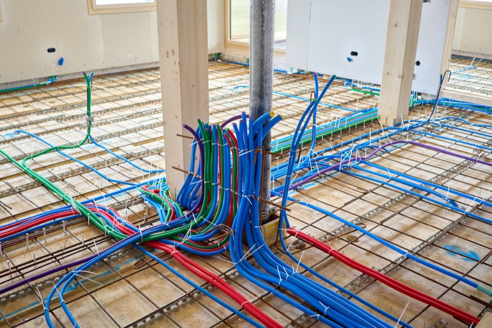 Radiant in-floor hydronic heating tubing laid out before a concrete pour